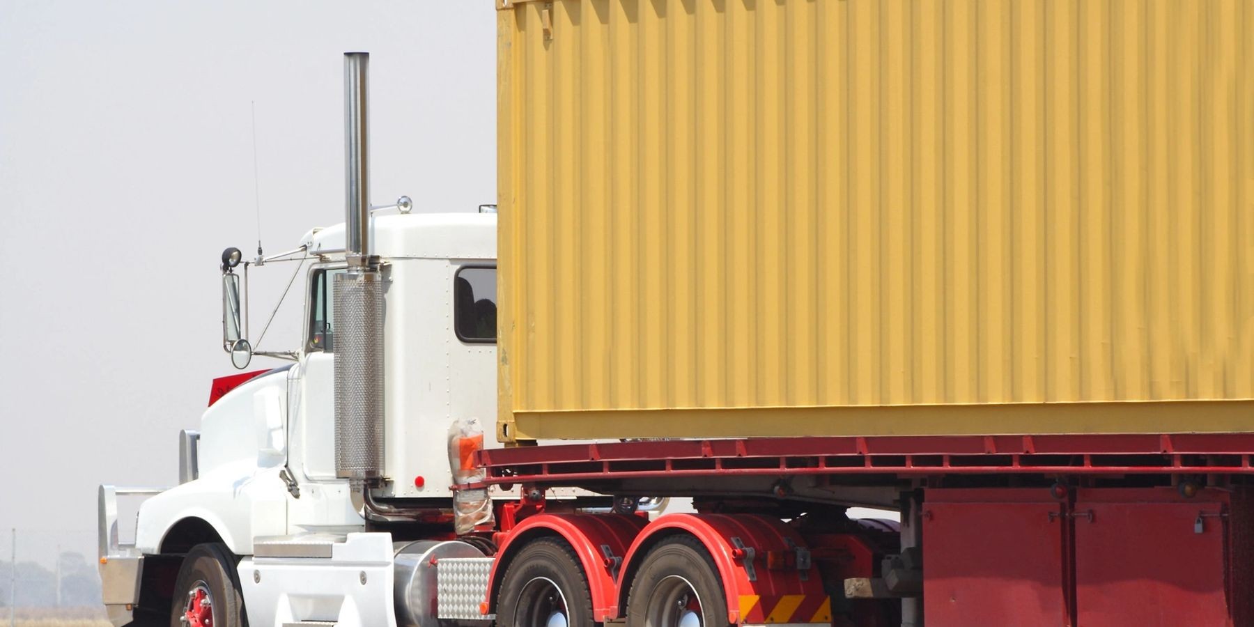 Truck transporting a container